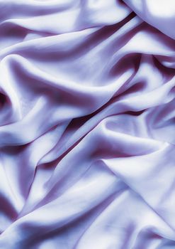 Elegant fabric texture, abstract backdrop and modern pastel colours concept - Purple soft silk waves, flatlay background