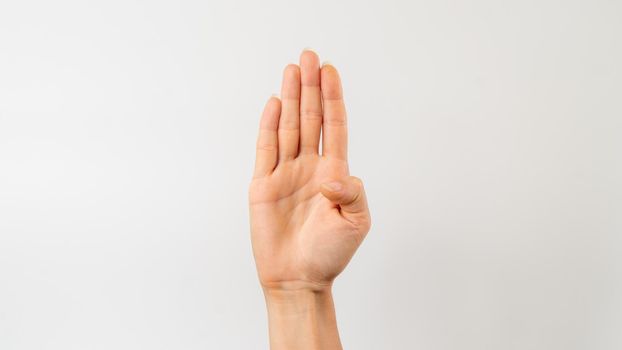 Sign language of the deaf and dumb people, English letter b, open hand with thumb pressed