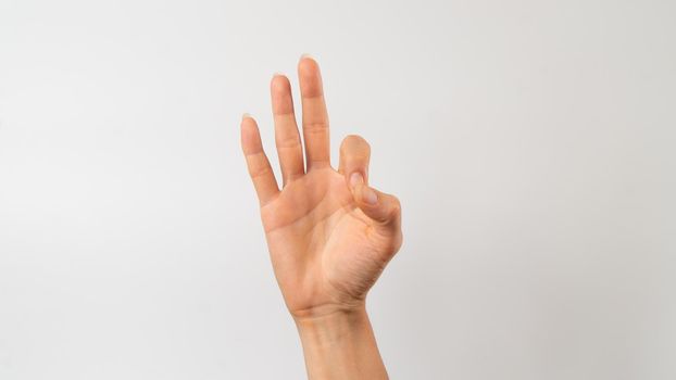 Sign language of the deaf and dumb people, number, digit nine. High quality photo