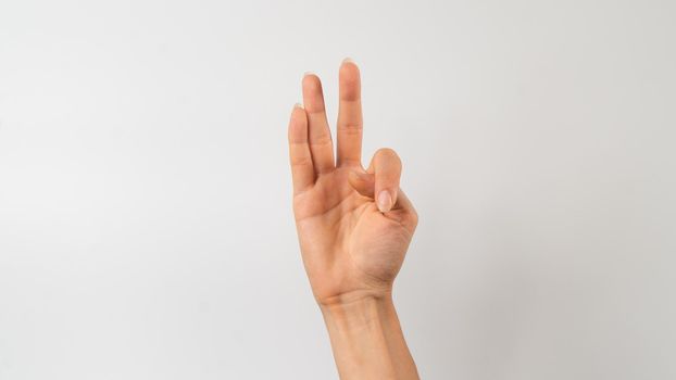 Sign language of the deaf and dumb people, English letter f. High quality photo