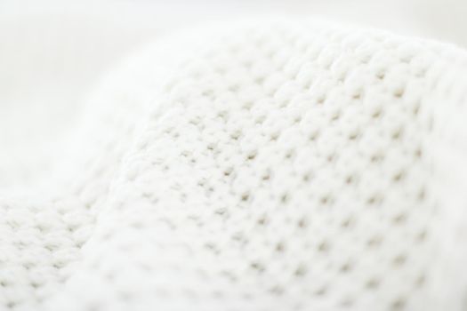 Knitwear, fabric textures and handmade items concept - Warm knitted clothes, soft and white