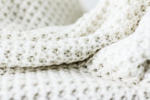 Knitwear, fabric textures and handmade items concept - Warm knitted clothes, soft and white