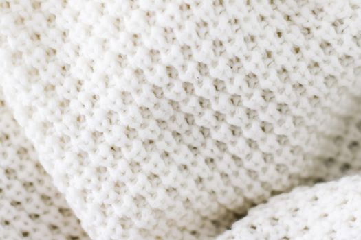 Knitwear, fabric textures and handmade items concept - Warm knitted clothes, soft and white