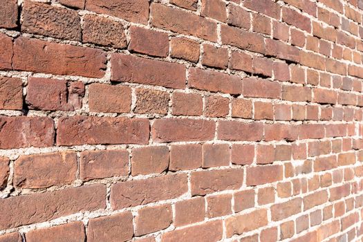 texture background brick wall made of old red brick. Old brickwork. perspective