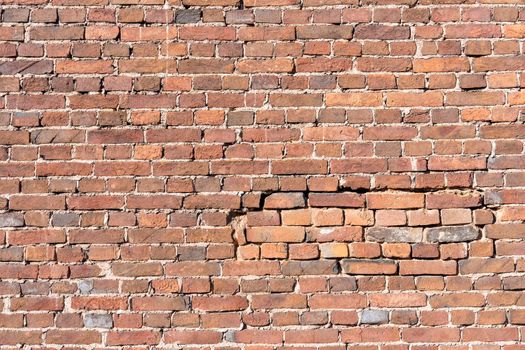 texture background brick wall made of old red brick. Old brickwork.