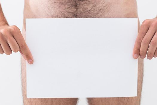 Naked guy with poster template, man holding paper.