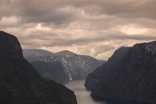 Mountains around Aurlandfjord with cloudy sky from Stegastein viewpoint