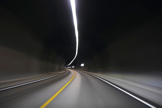 Movement inside a tunnel in a road from the car showing a sensation of speed