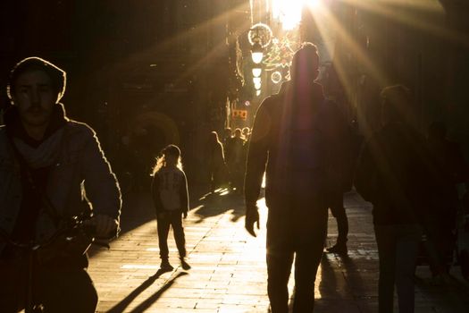 People walking in a street in Raval area in Barcelona