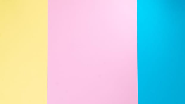 Background stripes in three colors - yellow, pink, blue paper. High quality photo