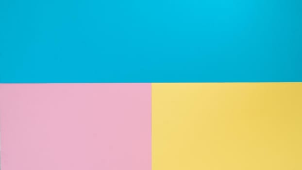 Background three colors of paper - blue, yellow, pink. High quality photo