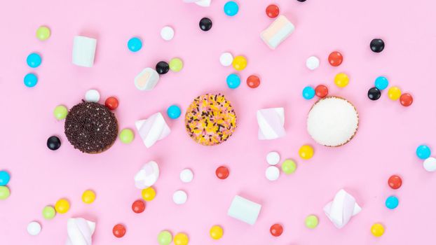 Pink sweets background - lozenges, cakes, sweets, marshmallows. High quality photo
