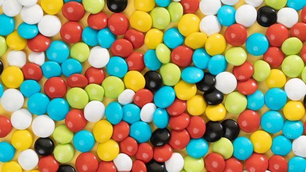 Background of multi-colored dragees, candy close-up. High quality photo