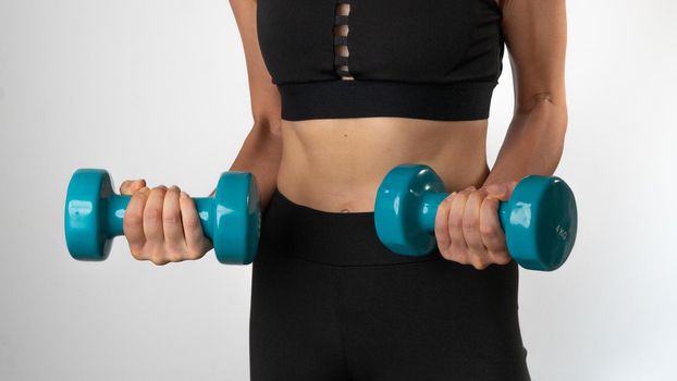 Home Workout Woman with Dumbbells - Sport. High quality photo