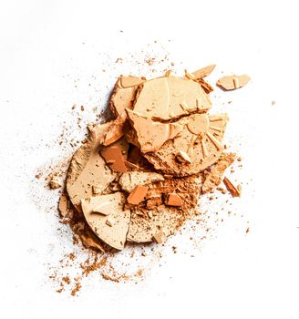 Beauty texture, cosmetic product and art of make-up concept - Crushed eyeshadows and powder isolated on white background