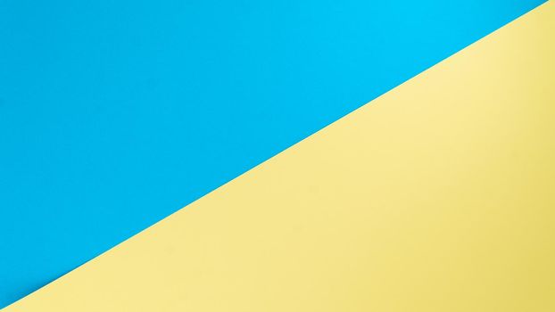 Background - two colors separate diagonal yellow and blue. High quality photo