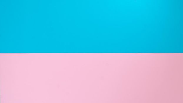 Two-tone background is divided in half - blue and pink. High quality photo