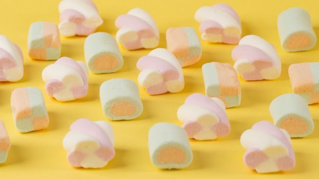 Marshmallows are stacked in rows, a background of sweet food. High quality photo