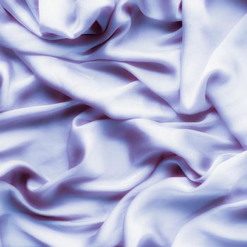 Elegant fabric texture, abstract backdrop and modern pastel colours concept - Purple soft silk waves, flatlay background