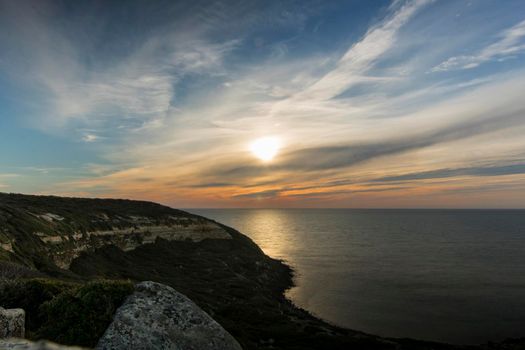 Sunset landscape showing Cape San Marco in Sardegna island in Italy in a long exposure picture