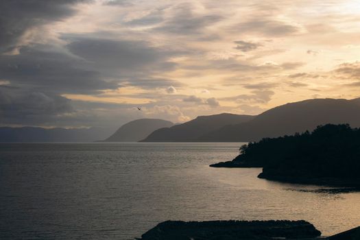 Landscape showing some mountains under a cloudy sky in Sognefjord in Norway