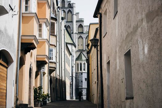 Perspective view of a street with an old man walking in an old town