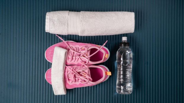 Gym workout kit - sneakers, towel, water. High quality photo