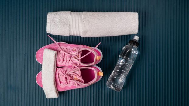 Gym workout kit - sneakers, towel, water. High quality photo