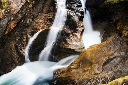 Beautiful landscape showing Krimmler waterfall in a rocky mountain in Austria in long exposure picture