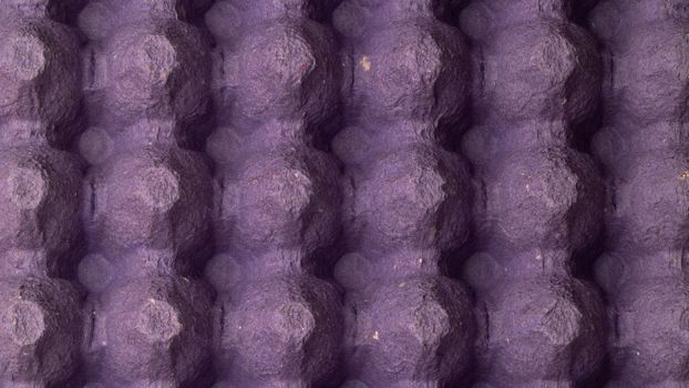 close-up egg lattice rack background three-dimensional pattern with bulges purple