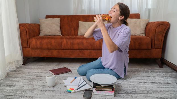 Female Student Eats Sandwich During Classes at Home - Online Education, Student Snack. High quality photo