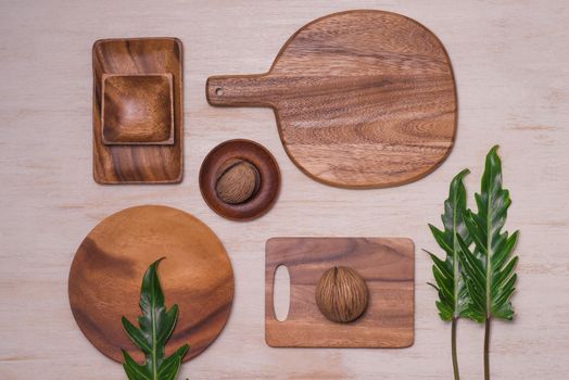 Set of wooden plates on wooden background