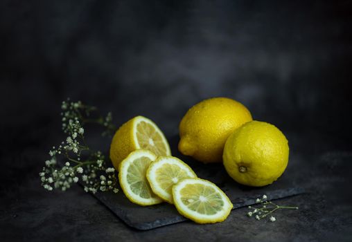 still life of berries and fruits on the table on a dark background photo