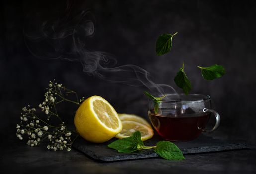 still life of berries and fruits on the table on a dark background photo