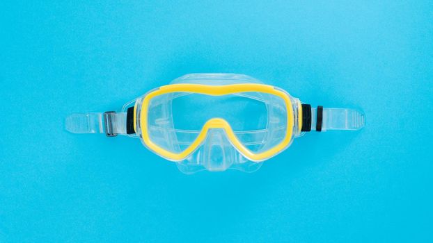 Scuba diving mask on a blue background. High quality photo