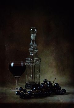 still life of berries and fruits on the table on a dark background photo