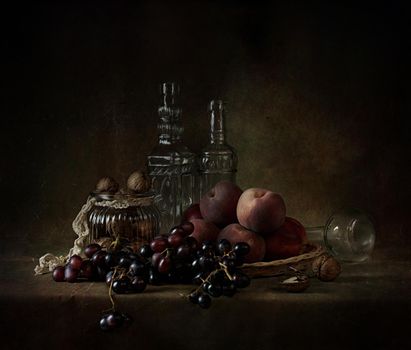 still life of berries and fruits on the table on a dark background photo