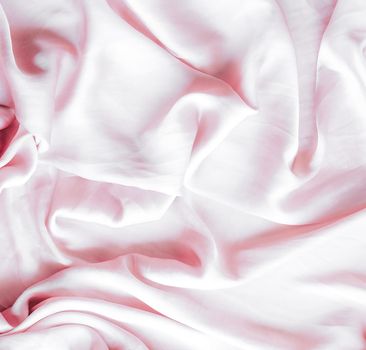 Elegant fabric texture, abstract backdrop and modern pastel colours concept - Pink soft silk waves, flatlay background