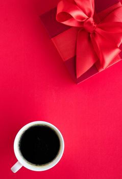 Romantic celebration, lifestyle and birthday present concept - Luxury beauty gift box and coffee on red, flatlay