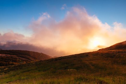 Landscape views of sunset from the summit of Mt Buller over the Victorian Alps in the Victorian High Country, Australia