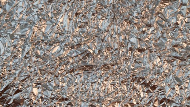 Rumpled foil texture background silver. High quality photo