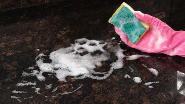 Wash the surface with a sponge and detergent with foam. High quality photo