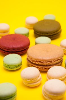 Delicious weeding french dessert over yellow background. Delicious french biscuits