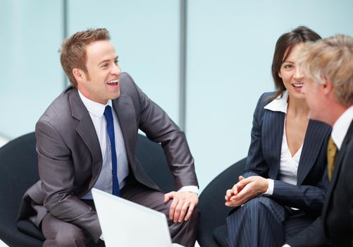 Business people having happy conversation. Portrait of business people having happy conversation at office