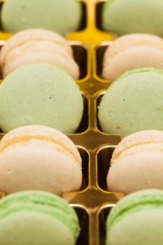 Row of colorful french macarons in the box. Traditional french dessert