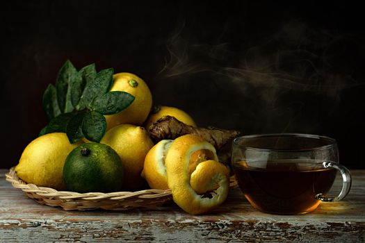 still life of berries and fruits on the table on a dark background photo