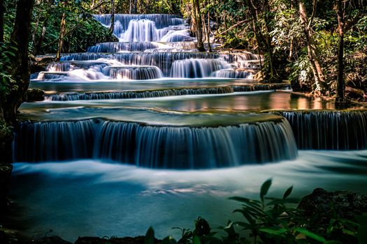 Long exposure exotic beautiful tropical deep rainforest waterfall Fresh turquoise waterfalls in deep forest of Huay Mae Khamin waterfall in the national park Beautiful landscape waterfalls.