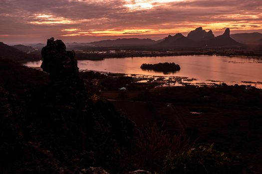 Panorama dramatic silhouette mountain landscape at sunset in the sea nature background