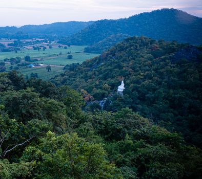 panorama mountain forest landscape  with white buddha statue on mountain