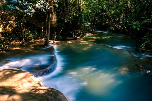 Long exposure exotic beautiful tropical deep rainforest waterfall Fresh turquoise waterfalls in deep forest of Huay Mae Khamin waterfall in the national park Beautiful landscape waterfalls.